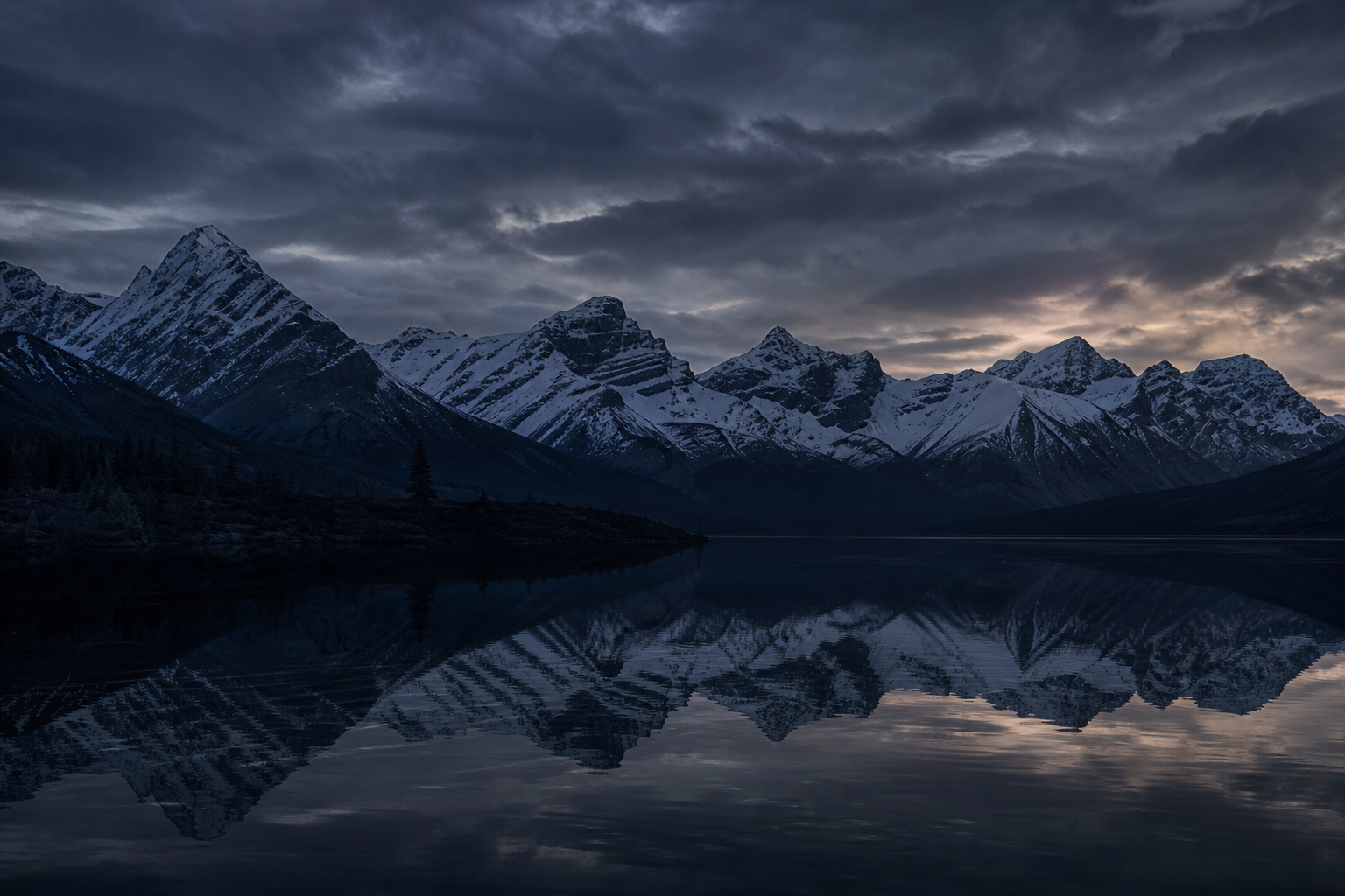 Mountain range reflected in a still alpine lake at dusk